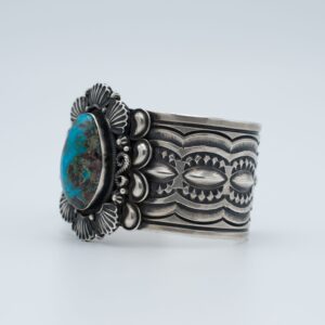 Breathtaking Bisbee Turquoise Bracelet by Navajo artist Delbert Gordon - large natural turquoise stone in ornate sterling silver cuff with traditional stampwork